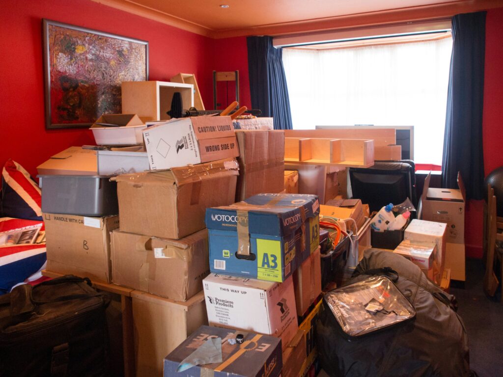 A very cluttered room, indicating that it's time to make the homeownership decision to move (or at least get rid of some things!)